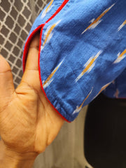 Blue Ikkat blouse with red piping