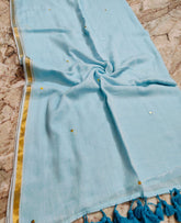 Sky blue golden bordered " Janvi " sequinned mul cotton saree