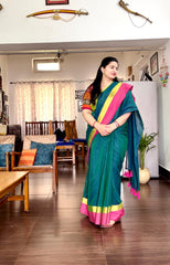 Pink and neon green bordered peacock green mul cotton saree