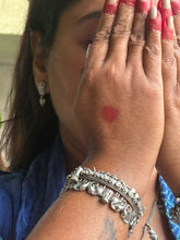 Silver replica elephant bangle with stones