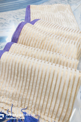 Purple bordered cream "Festive edit " collection of mul cotton saree