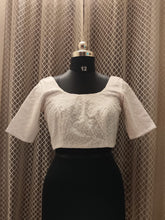 White machine embroidered blouse