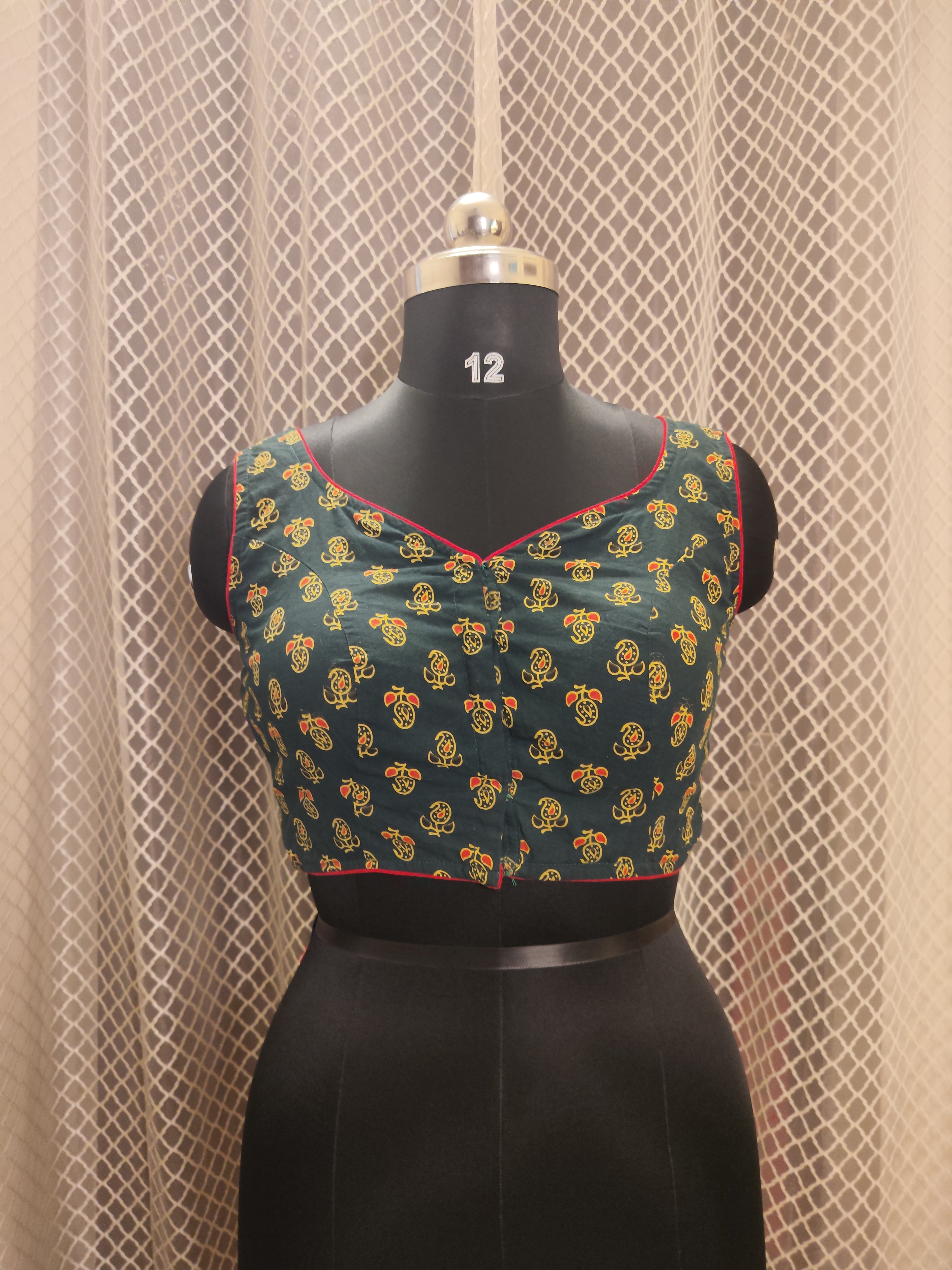 Bottle green Ajrakh backless sleeveless blouse with red piping