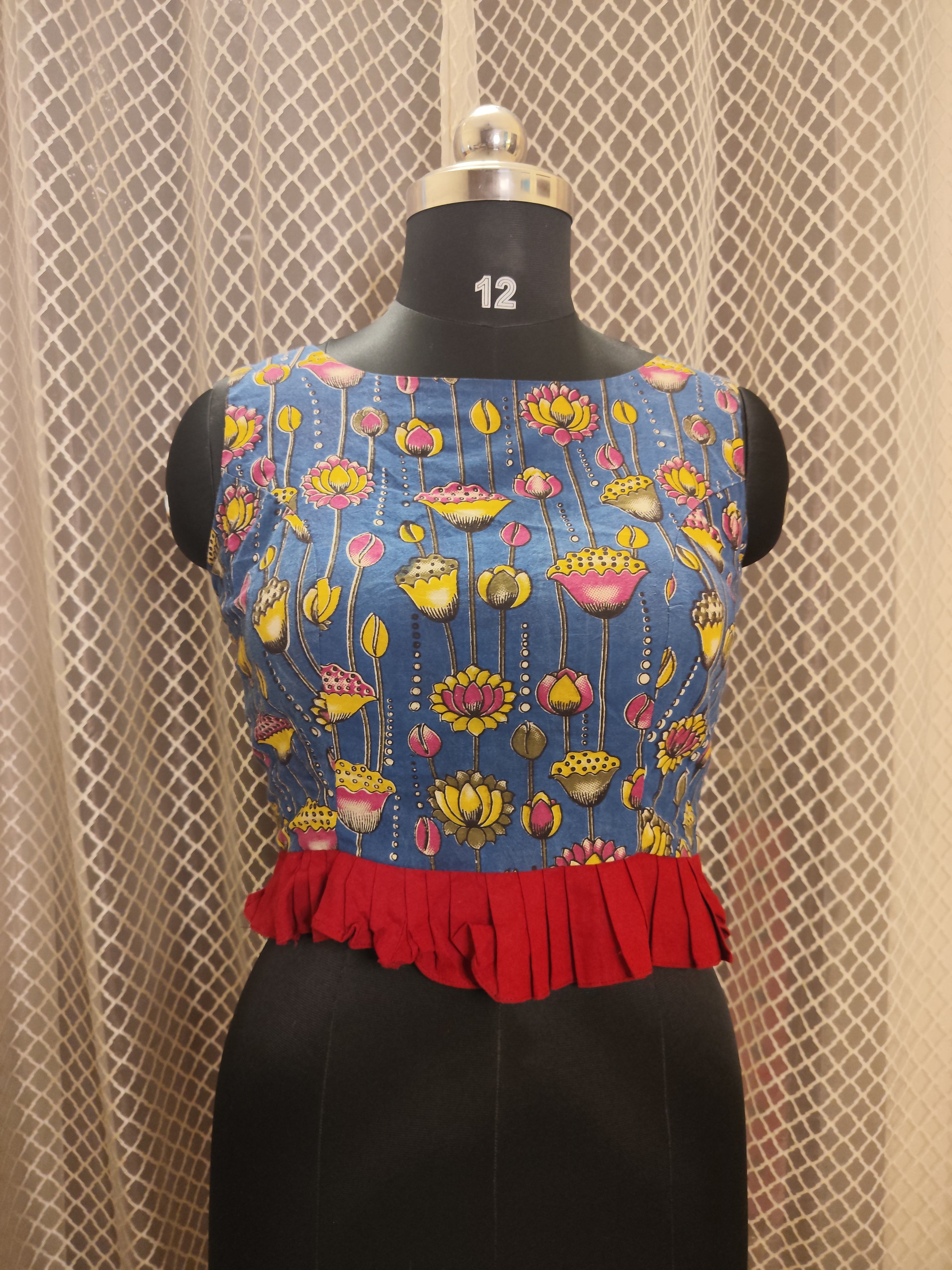 Printed sleeveless cotton blouse with frills