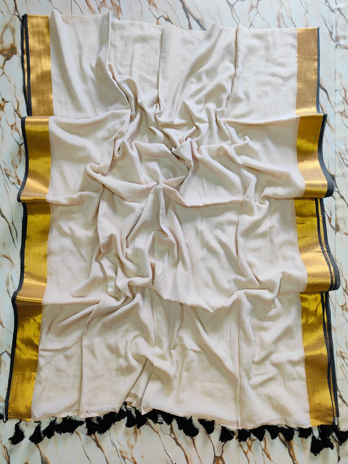 Black and gold bordered beige mul cotton saree