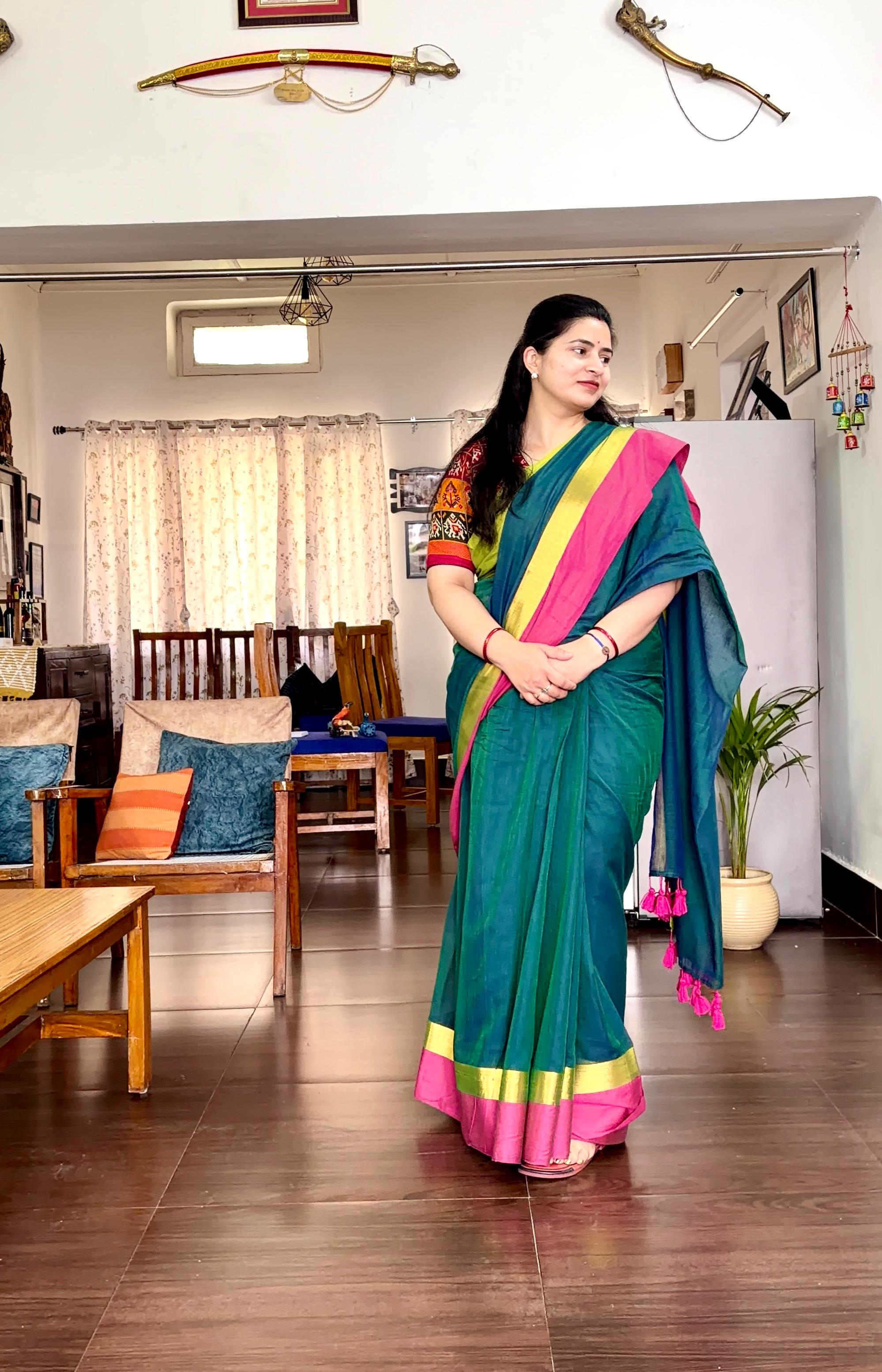 Pink and neon green bordered peacock green mul cotton saree