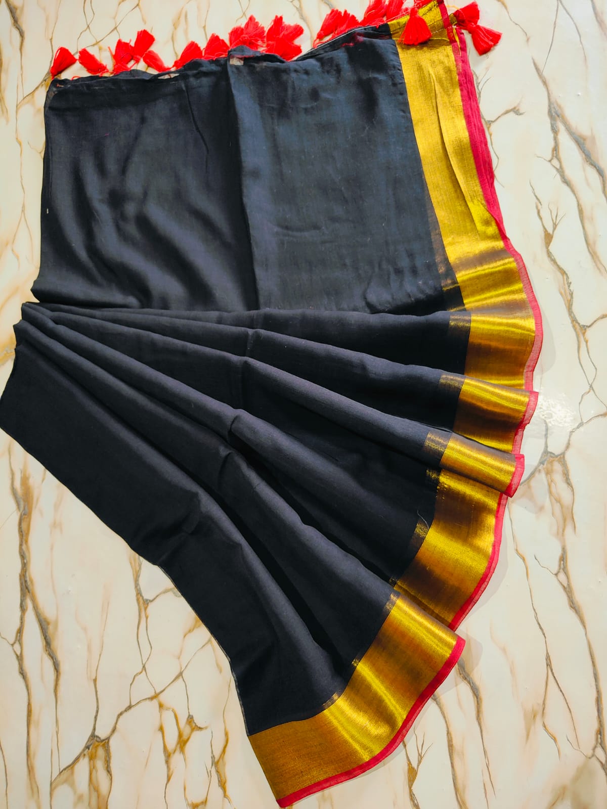 Black and gold bordered beige mul cotton saree