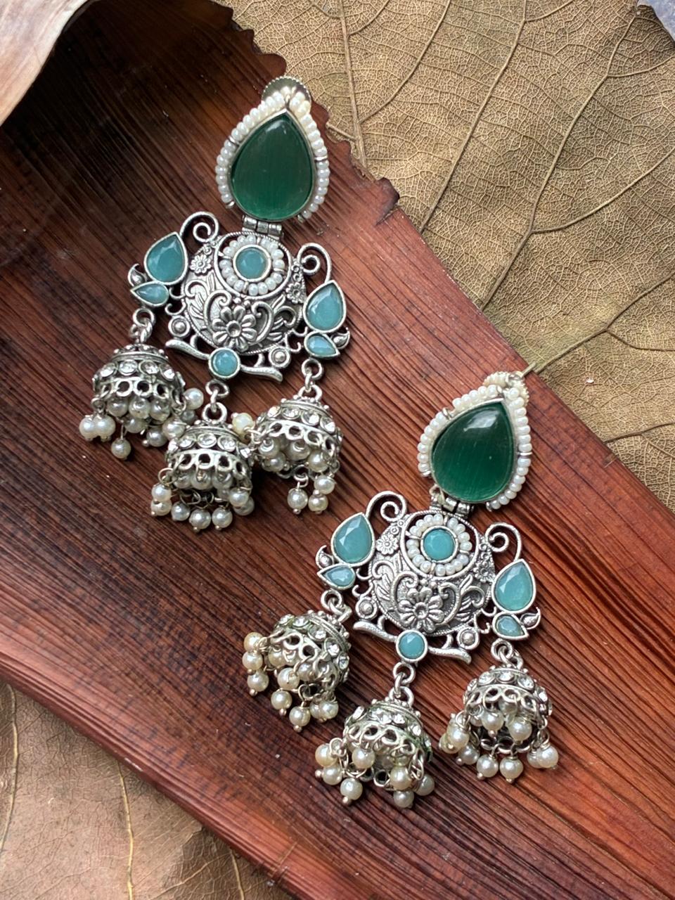 Silver replica ear jhumka mint stone