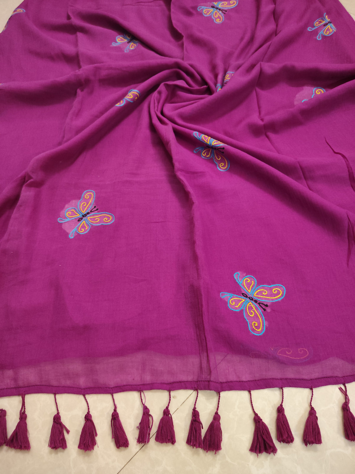 Magenta mul saree with butterfly embroidery