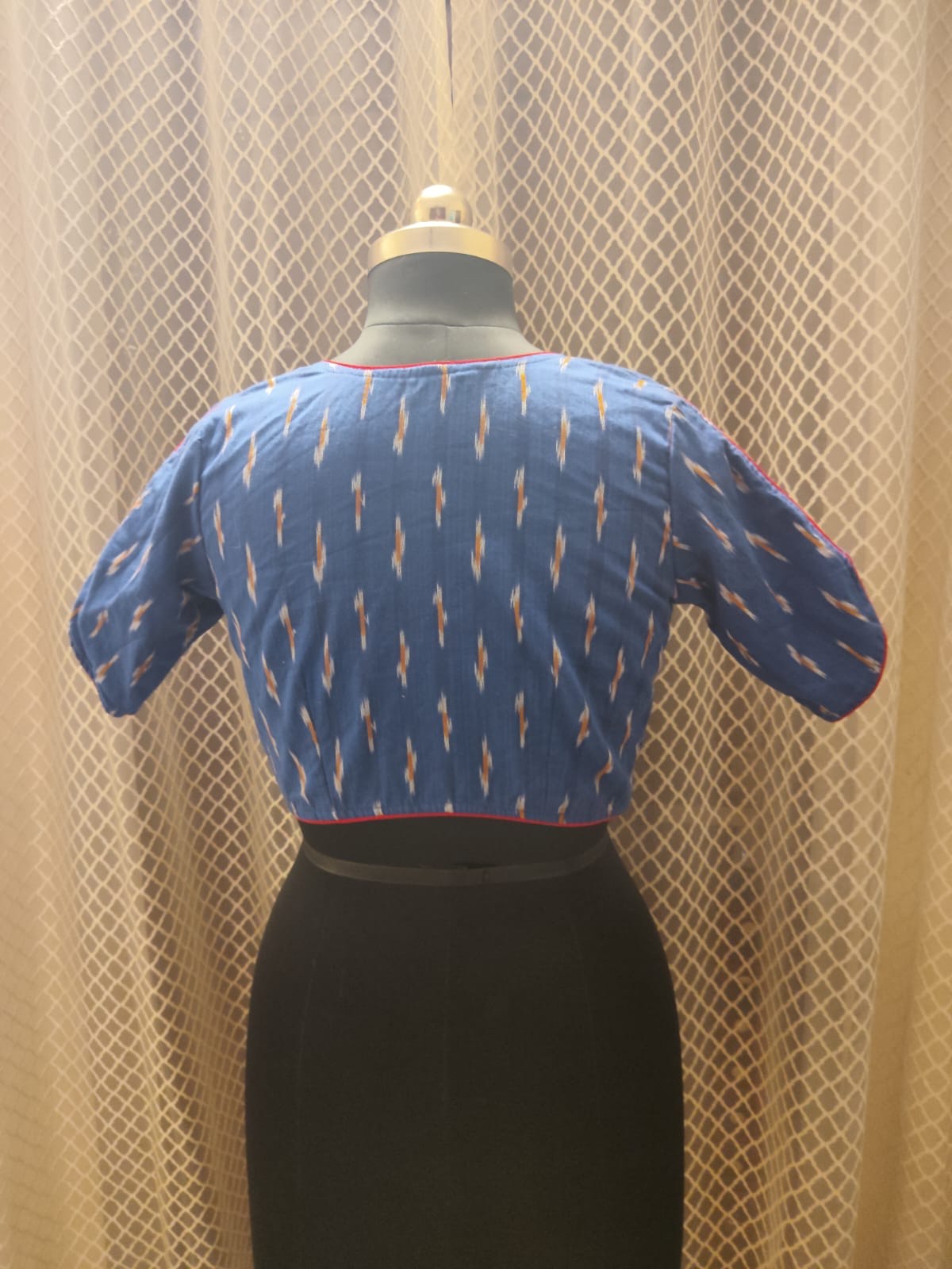 Blue Ikkat blouse with red piping